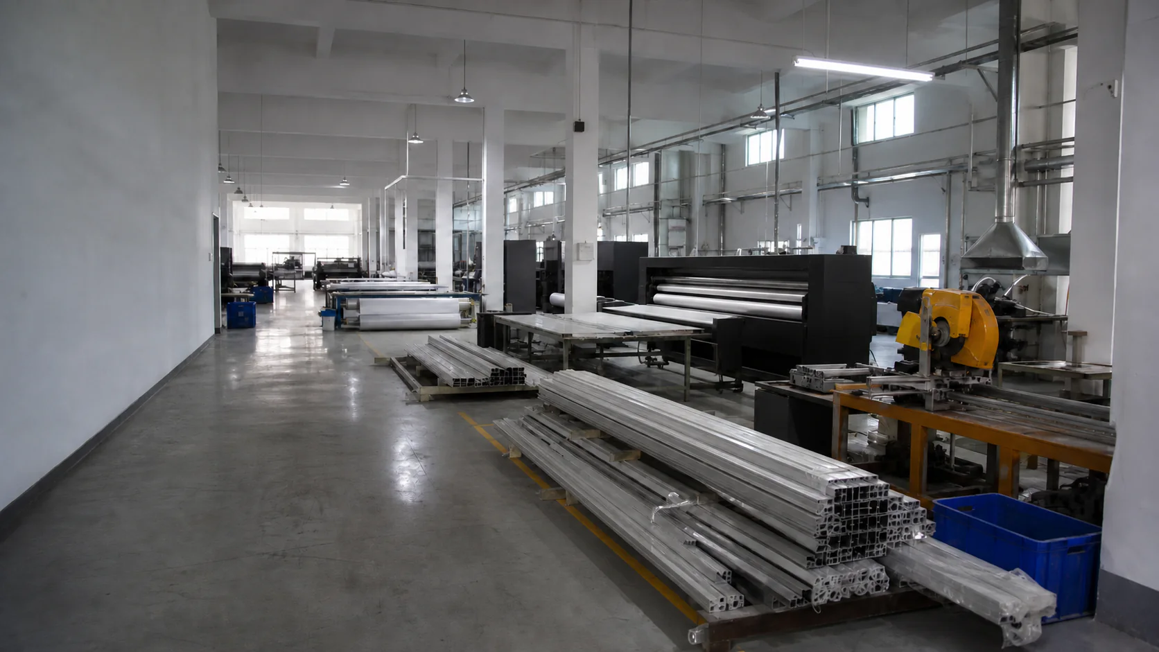 Wide-format printing and aluminum frame production inside an outdoor display workshop