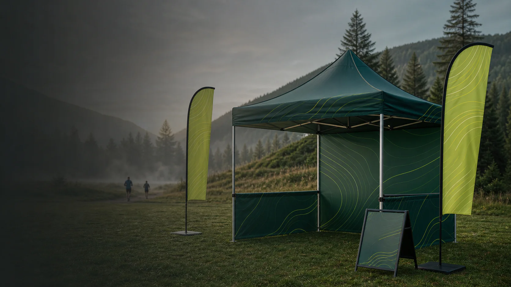 Custom outdoor event tent, feather flags and A-frame display in a mountain event setting